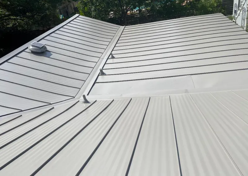 Solar attic fan installed on a metal roof for Roof Ventilation in Vicksburg